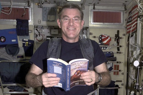 nasa Astronaut James Voss reading in space. (Photo: NASA via LibraryThing)